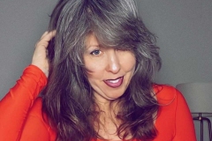 Dani Orange Touching Hair